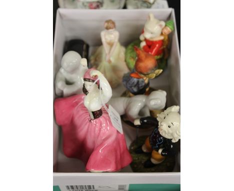 Collection of porcelain figures, consisting of Royal Doulton and Coalport ladies, Rupert, Goebel, Limoges and two white Taiwa