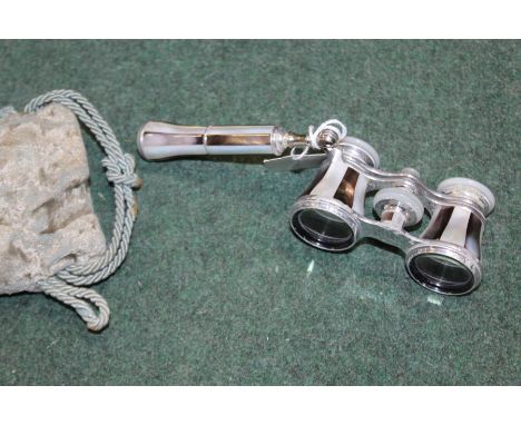 Pair of mother of pearl mounted opera glasses, with folding handle, housed in a silk lined drawstring pouch