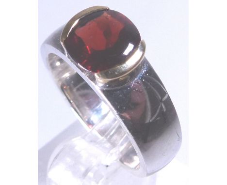 SILVER & 14 K GARNET RING. Silver and 14 K gold ring set with garnet