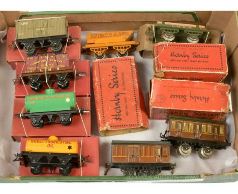 Hornby O Gauge a mixed group of pre and post-war Rolling Stock consisting of an early LNER No.1 Timber Wagon in a straw type 