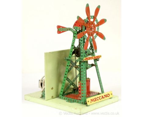 Meccano Binns Road factory built light red and green shop window display model of a wind pump on a grey base operated by a ma