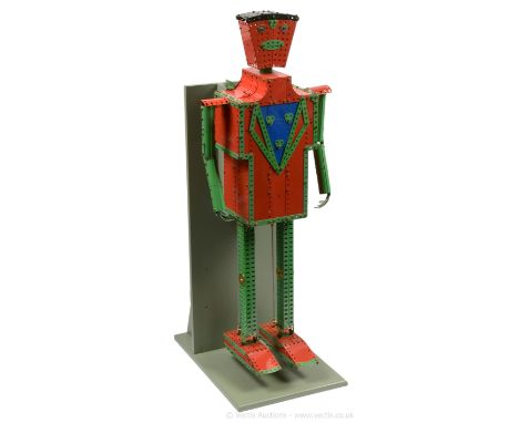 Meccano light red and green 1960's display model of the Meccano Walking Robot, built and mounted on a display stand and works