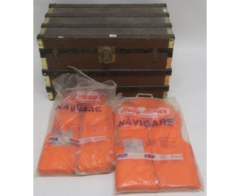 A wood bound travel trunk and two life jackets (2) Condition Report: Available upon request