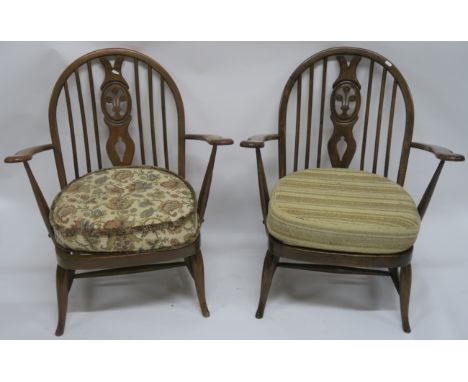 A pair of Ercol Fleur de Lys armchairs (2) Condition Report: Available upon request