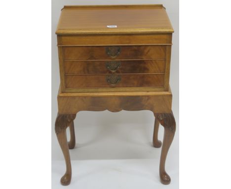A light mahogany three drawer chest on carved cabriole legs, 77cm high x 46cm wide x 29cm deep Condition Report: Available up