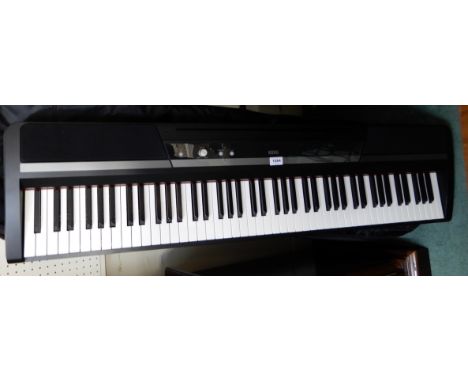 A Korg digital piano, model SP-170S with foot pedal and a Stagg gig bag (af) Condition Report: Available upon request