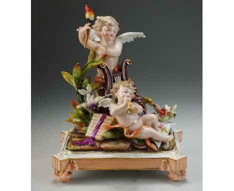 A Rudolstadt Volkstedt (Richard Eckert and Co) porcelain figural group, circa 1900, modelled as two winged putto, the first h