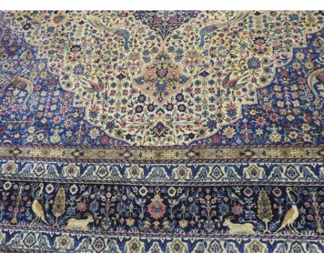 A large 20th century Persian design blue ground carpet approx 15'x11'

Provenance: Bowdon Old Hall, Cheshire