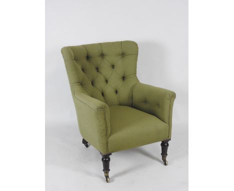 A Victorian button back easy chair, recovered in a green fabric, on short turned and tapering front legs, terminating in bras
