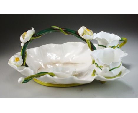 A George Jones and Sons strawberry dish, late 19th century, the white glazed dish with green stem effect handle intertwined w