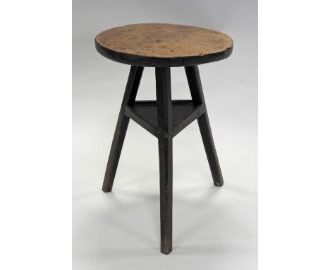 A 19th century oak primitive cricket type occasional table on three out-swept legs united by a triangular shelf stretcher, 39