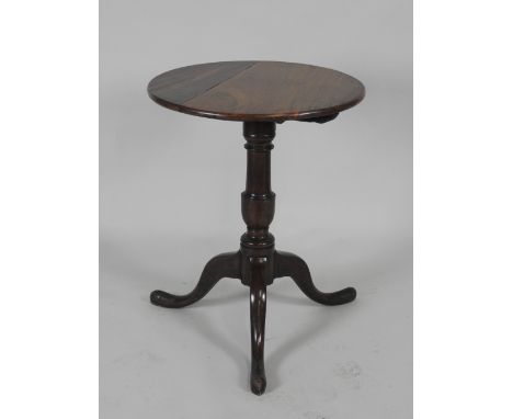 A George III and later mahogany tilt-top supper table, the reduced top on a turned column and tripod base, 58cm diameter, 72c