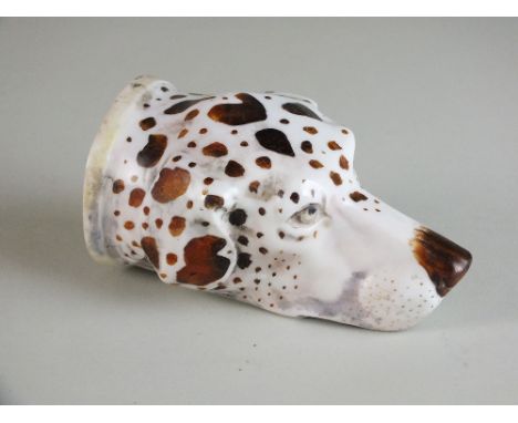 A Copeland and Garrett porcelain hound head stirrup cup, circa 1830-40, realistically modelled and painted with brown patches
