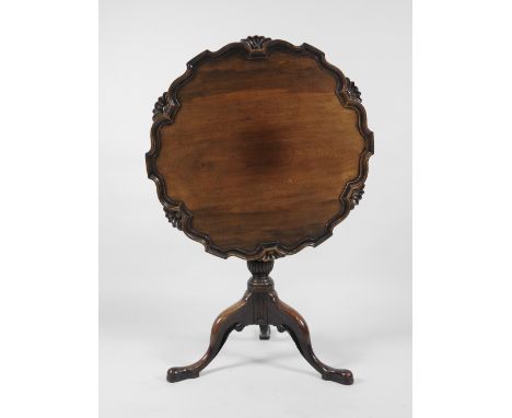 A George III and later mahogany tilt-top supper table the top with pie-crust edge on a short turned column and tripod base. 7