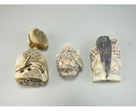 Three Japanese ivory netsuke, Meiji/Taisho era, the first of Jurojin, the second a figure with revolving twin-faced head and 