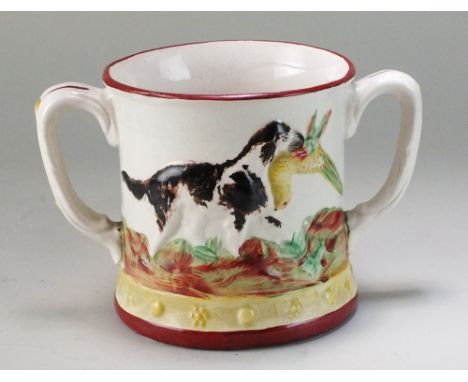 A Staffordshire twin handled frog mug, mid-19th century, the exterior decorated with hunting dogs chasing and catching game b