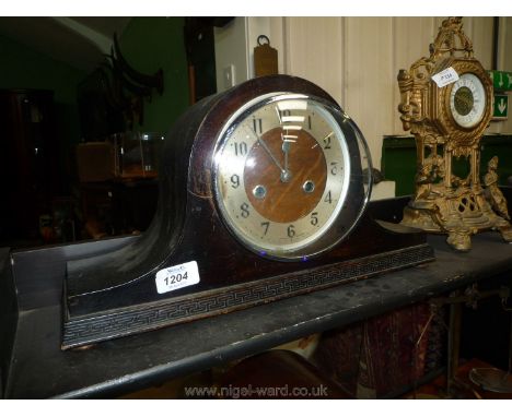 A Napoleon hat style mantle clock.