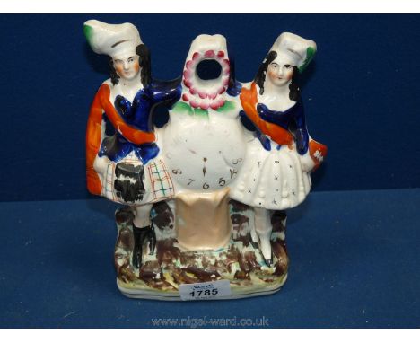A Staffordshire flatback/clock face figure