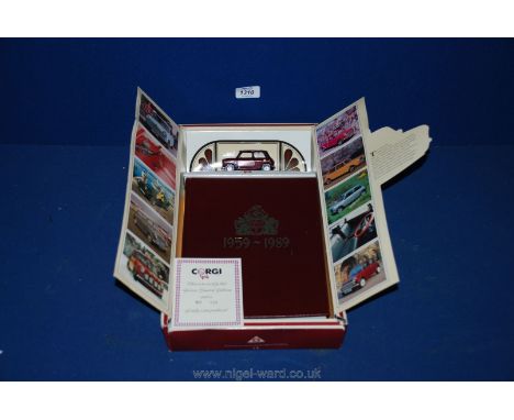 A Corgi mini car and book; 30th anniversary.