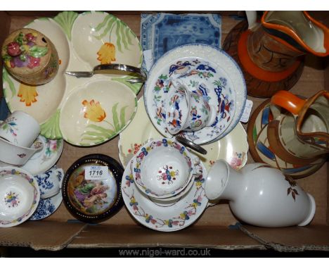 A box of china and pottery including two Delft tiles, Myotts jug, Crown Devon vase, etc.