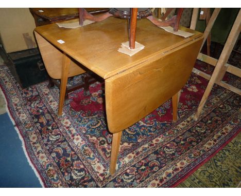 An Ercol style Elm dropleaf Dining Table, 29 1/2'' x 24'' extending to 54'', open