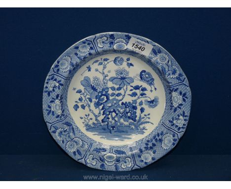 A late 18th century rare Spode soup dish decorated in blue with peonies, rockwork and insects with wide floral border impress