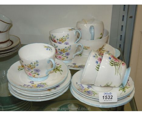 A Shelley fine porcelain part tea set in hand-painted wild flowers pattern comprising of five cups, saucers and side plates, 