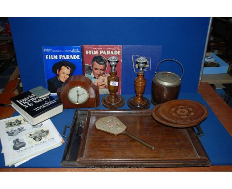 A quantity of treen and miscellanea including trays, candlesticks, clock, plates, Hollywood books, biscuit barrel, etc.