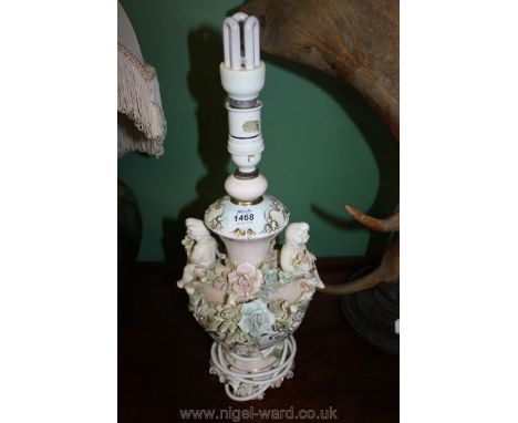 An elaborate porcelain Lamp base in rococo style