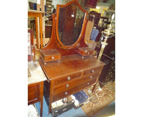 An Edwardian Mahogany Dressing Table with light/darkwood stringing, shield shaped bevelled mirror in supports with two trivet