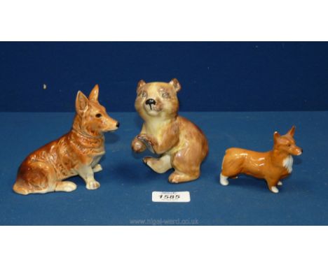 A Beswick Corgi, West German Corgi and a Wedgwood &amp; Co dancing bear, all a/f.