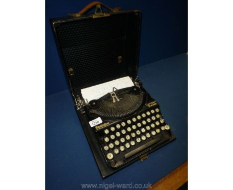 A Remington Compact Portable Typewriter.