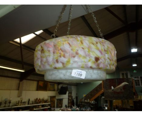 A mottled glass hanging light shade.