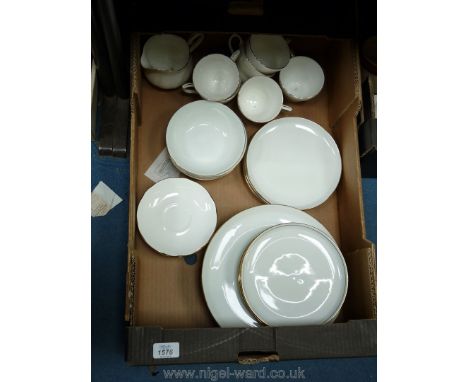 A quality of white with gold trim part dinner/ tea service to include cups, saucers, dinner plates, bowls and smaller plates.