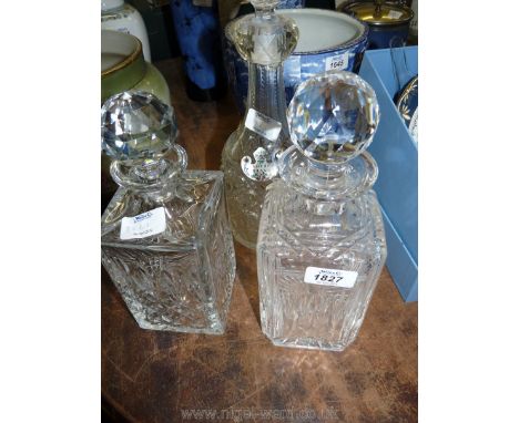 Three glass Decanters, one with enamel label.