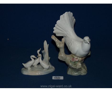 A Nao three ducks ornament and a china Dove seated on a branch ornament.