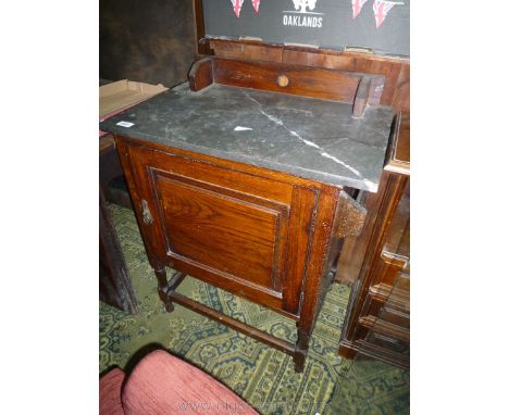 A compact Oak marble top Washstand with raised and fielded door and towel rail to one side, raised on turned legs with perime