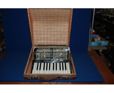 A cased Worldmaster Accordion