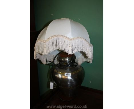 A metal based Lamp with cream shade