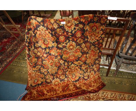 A carpet 102" x 80" in brown and red