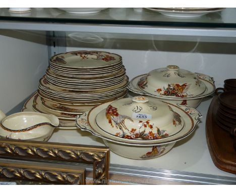 A Woods ivoryware Dinner service comprising eighteen plates, three meat plates, two tureens and sauce boat