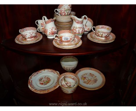 A quantity of oriental china including cups, saucers, tea plates, milk jug, sugar bowl, bread/butter plates in orange pattern