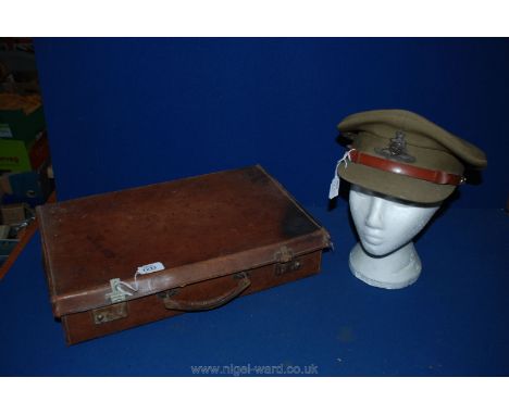 A small vintage leather Suitcase together with a Officer's cap, British Army.