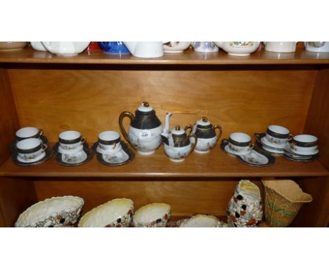 A Japanese egg shell Porcelain Teaset including very interesting sandwich and tea plates, 17 pieces in total, one a/f, teapot