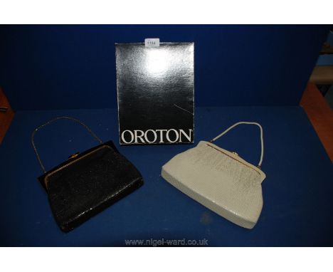 A vintage black mesh Oroton handbag and tooled leather purse, white mesh Oroton handbag with matching purse, both as new and 