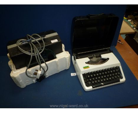 A Brother cased typewriter and a Photoax multi 8 P1110 Projector