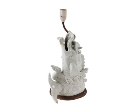 A Japanese Hirado porcelain dragon fish figure on a brass lamp base fitting, 32cms high excluding fitments.Condition ReportTh