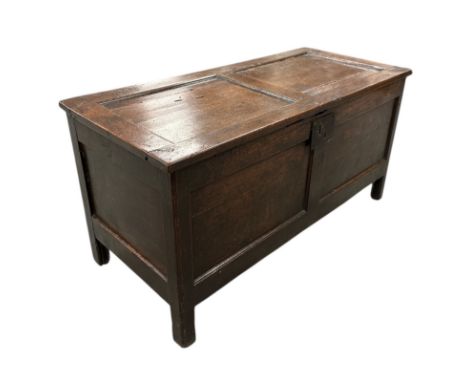 An 18th century style oak panelled coffer, 98cms wide.Condition ReportThere are replacement hinges and lock, a crack to the t