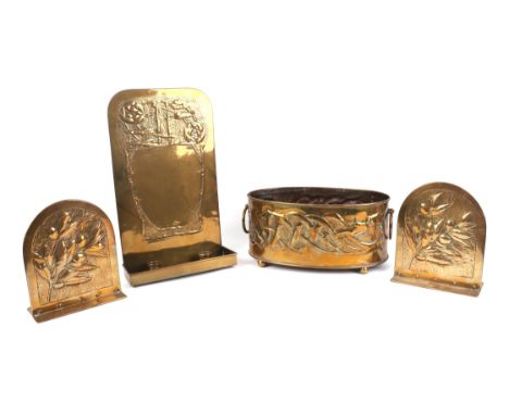 An Art Nouveau brass twin-candle wall sconce, 22 by 37cms; together with a similar pair of brass bookends and an Arts & Craft