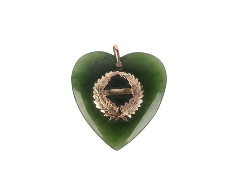 A Victorian jade / nephrite heart shaped pendant with 9ct gold decoration and loop, approx 9.4g.